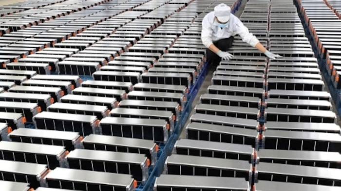 A worker inspects batteries at a factory in Nanjing, China