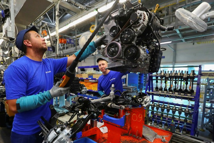 A worker on an assembly line at a Hyundai Motor car factory in Russia