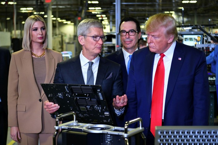 US President Donald Trump and Apple CEO Tim Cook, with Ivanka Trump and Treasury secretary Steven Mnuchin, at the Flextronics computer manufacturing facility in Austin, Texas