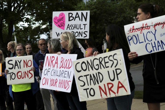 Gun-control advocates protest outside of the National Rifle Association HQ in Fairfax, Virginia. The issue is one of the social battles forcing CEOs to take sides